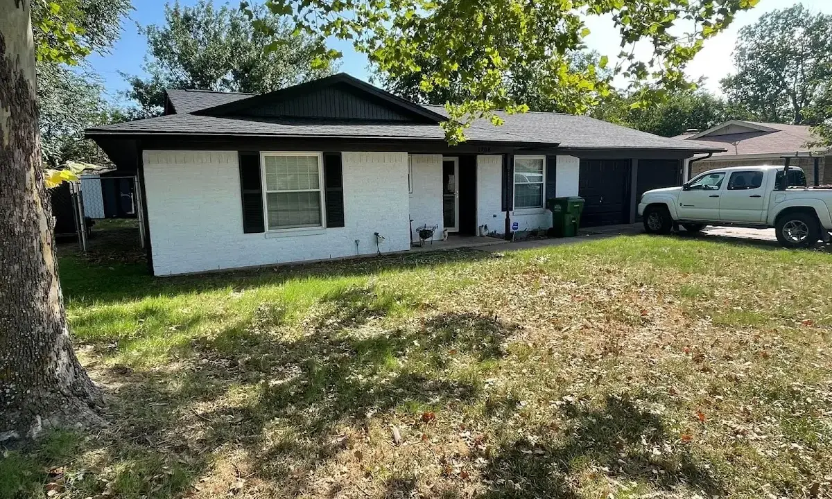 Professional roofing crew working on a residential roof in Wilmington